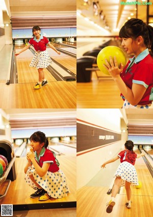 A woman in a red shirt and blue and white polka dot skirt.