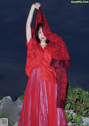 A woman in a plastic bag is posing for a magazine.