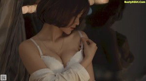 A woman in a white lingerie laying on a wooden floor.