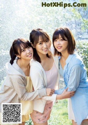 A group of three young women posing for a magazine cover.