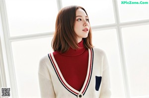 A naked asian woman with a scarf around her neck.