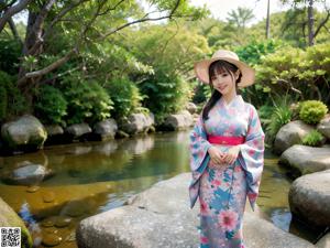 A woman in a kimono standing in a hotel room.