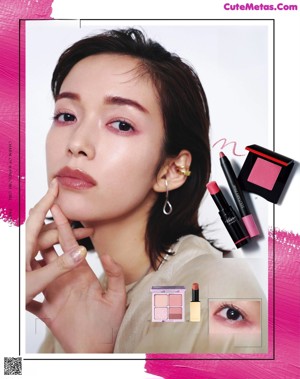 A magazine page with a picture of a woman applying makeup.