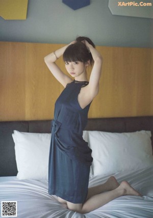 A woman in a kimono is posing for a picture.